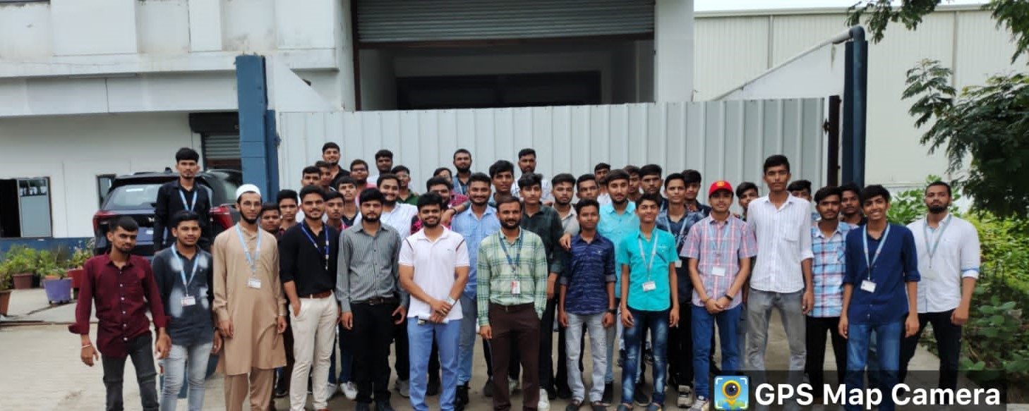 Students on an industrial visit outside the Por manufacturing unit
